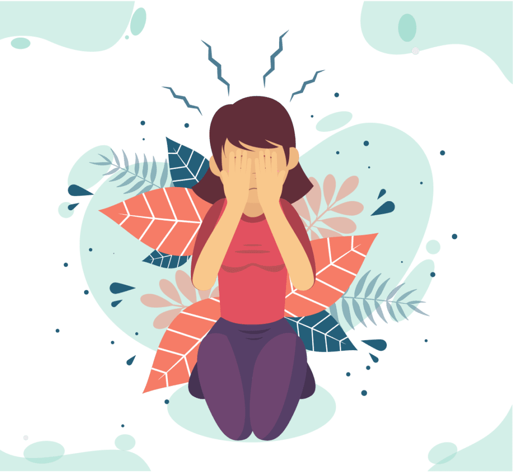 a women deals with anxiety with her face in her hands