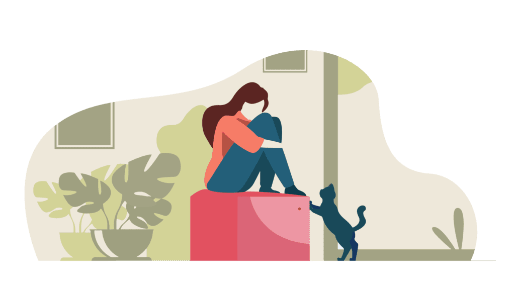 a women who is depressed sits with her legs tucked into her torso