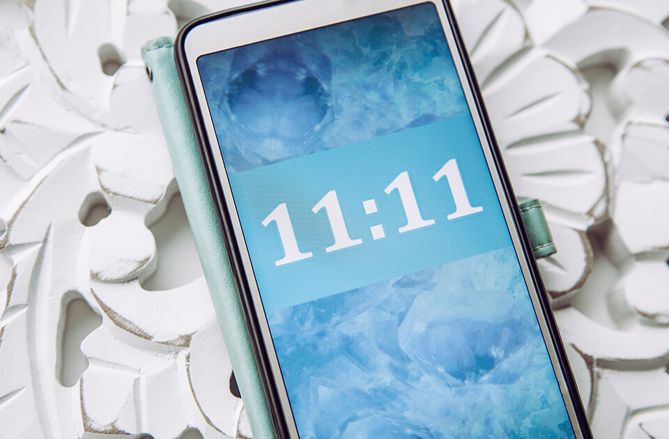 Angel Number 111 appearing on a phone